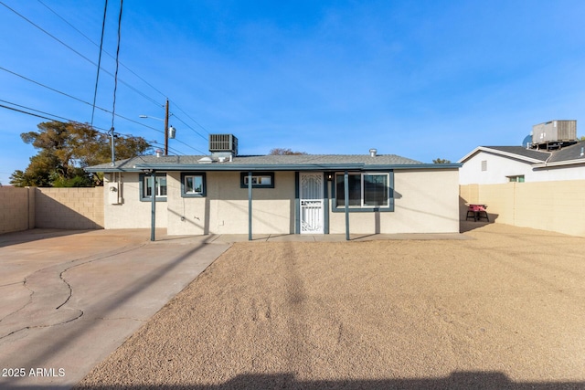 back of house featuring central AC unit and a patio