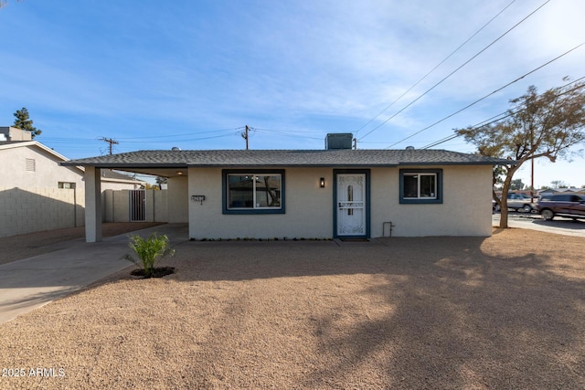 single story home with a carport