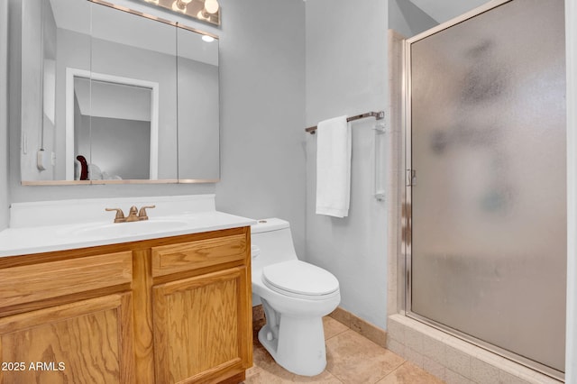 full bathroom with toilet, vanity, a shower stall, and tile patterned floors