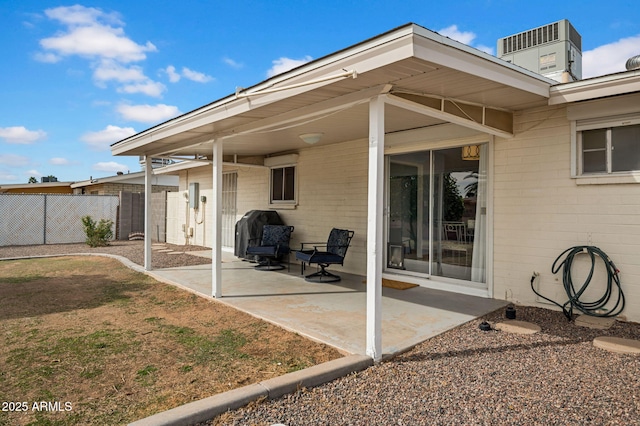 view of patio / terrace featuring fence and central AC