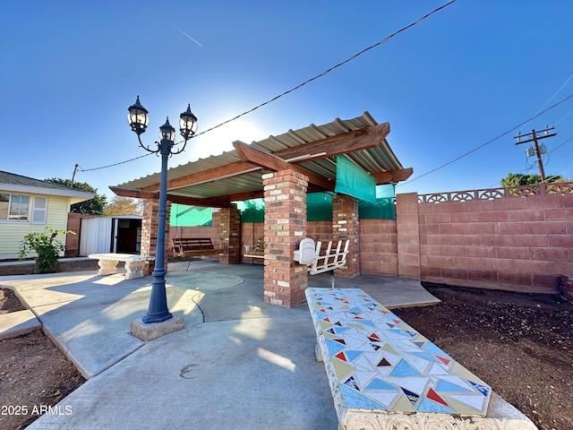 view of patio with a shed