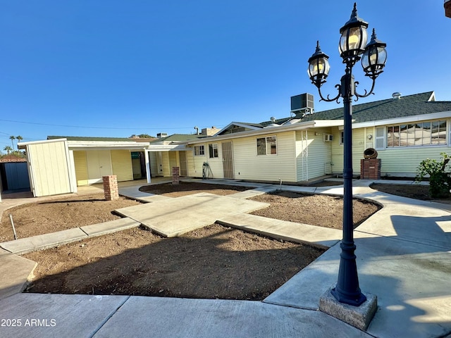 view of front of home featuring cooling unit