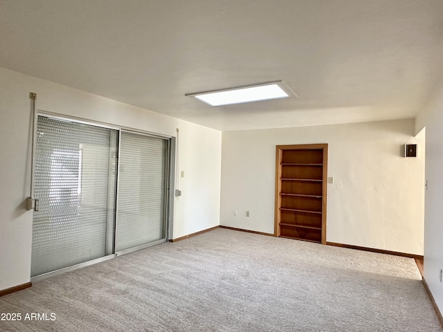 unfurnished bedroom featuring light colored carpet