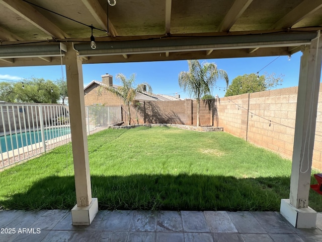 view of yard with a fenced in pool and a fenced backyard