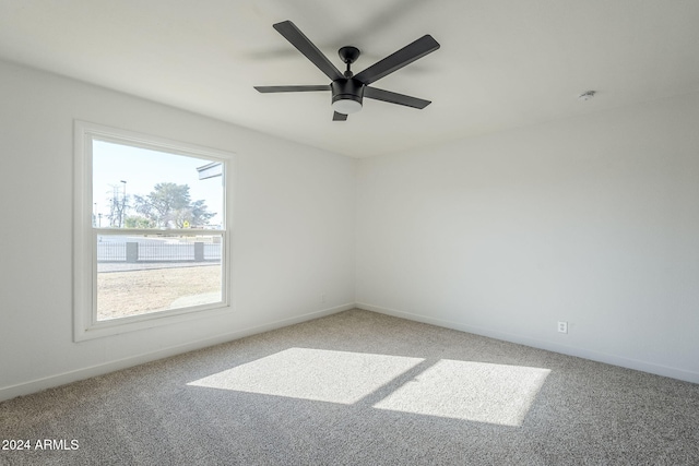 spare room with carpet flooring and ceiling fan