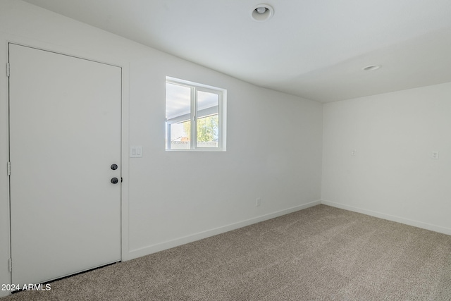 empty room with carpet flooring