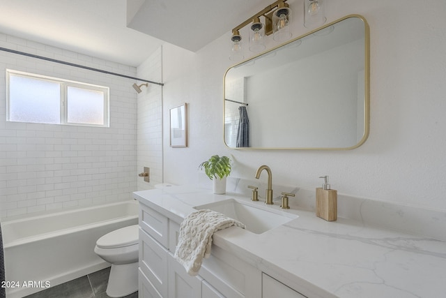 full bathroom featuring tile patterned flooring, vanity, toilet, and tiled shower / bath combo