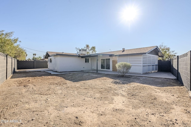 back of house with a patio area