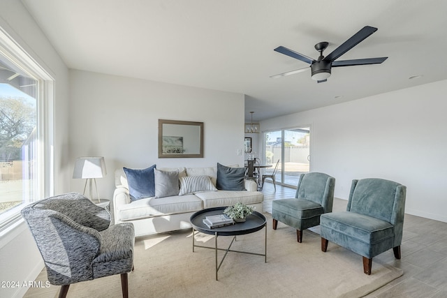 living room with hardwood / wood-style floors and ceiling fan