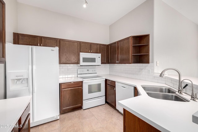3713 W Nancy Ln, Phoenix, AZ 85041 - kitchen with white appliances, open shelves, backsplash, light countertops, and light tile patterned floors