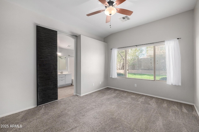 3713 W Nancy Ln, Phoenix, AZ 85041 - unfurnished bedroom featuring light colored carpet, ensuite bathroom, and ceiling fan