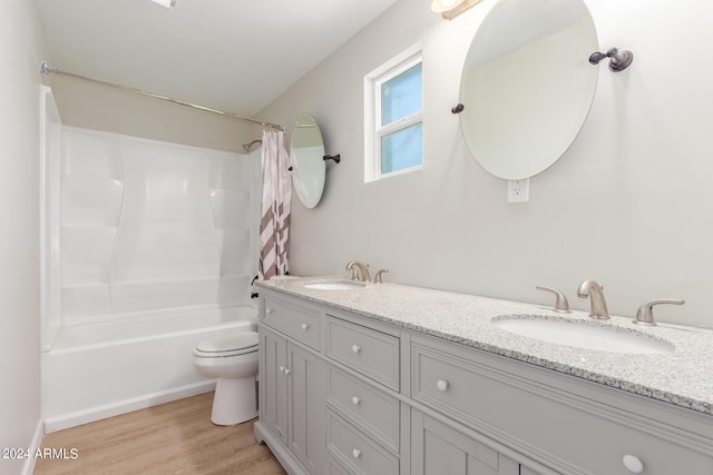 9424 N 2nd Pl, Phoenix, AZ 85020 - full bathroom with double vanity, wood finished floors, a sink, and toilet