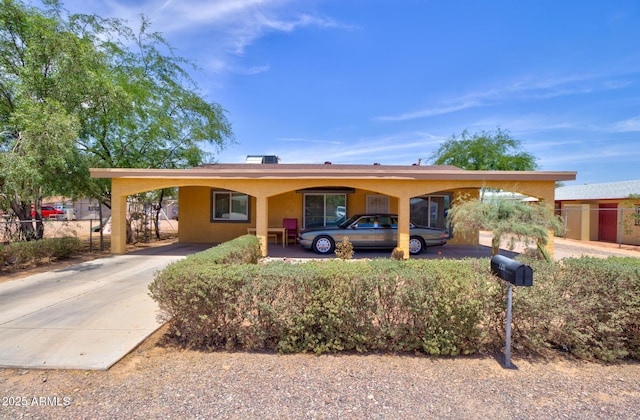 720 W Dewey Ave, Coolidge, AZ 85128 - view of front of property featuring stucco siding, driveway, and an attached carport