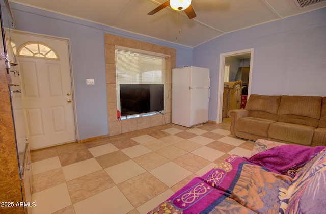 720 W Dewey Ave, Coolidge, AZ 85128 - living area with a ceiling fan, light tile patterned flooring, and vaulted ceiling