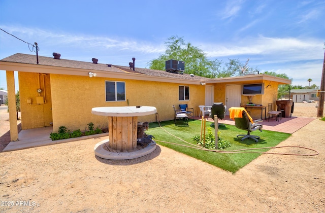 720 W Dewey Ave, Coolidge, AZ 85128 - rear view of property featuring stucco siding, a patio, and central AC unit