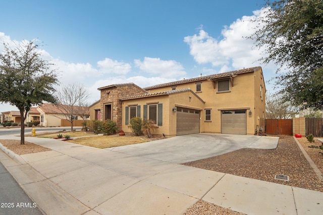 mediterranean / spanish-style home with a garage