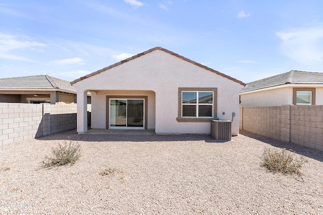 back of property featuring central air condition unit, a patio, a fenced backyard, and stucco siding