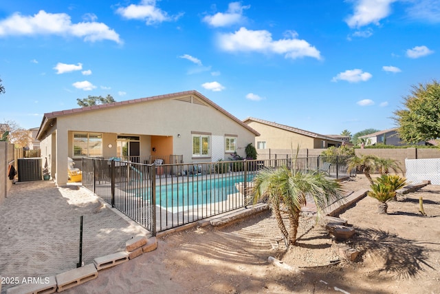 view of swimming pool with central AC unit, a patio area, fence, and a fenced in pool