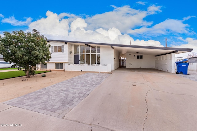 view of front of home featuring a carport