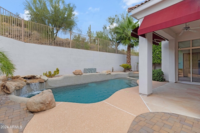 view of swimming pool featuring a patio, pool water feature, and ceiling fan