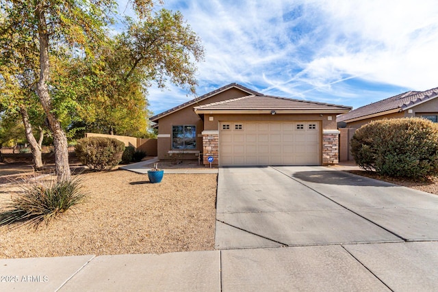 ranch-style house with stucco siding, concrete driveway, a garage, stone siding, and a tiled roof