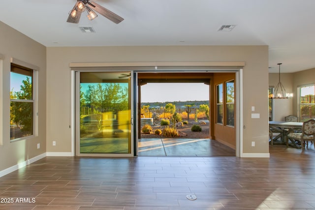 3285 Big Sky Dr, Wickenburg, AZ 85390 - unfurnished room featuring wood tiled floors, a chandelier, baseboards, and ceiling fan
