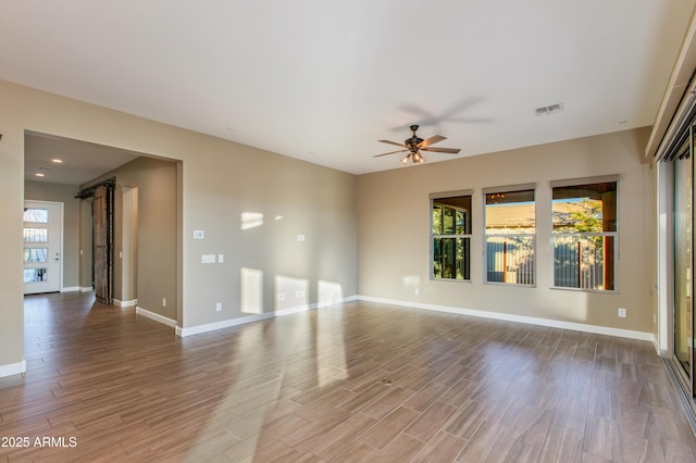 3285 Big Sky Dr, Wickenburg, AZ 85390 - empty room with a ceiling fan, healthy amount of natural light, and wood finished floors