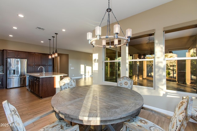 3285 Big Sky Dr, Wickenburg, AZ 85390 - dining room with a chandelier, baseboards, recessed lighting, and light wood finished floors