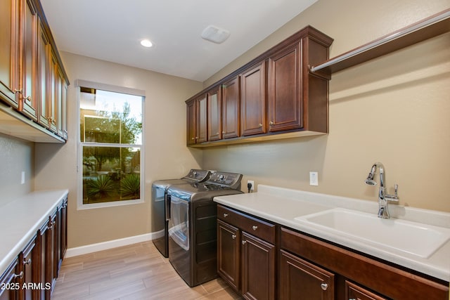 3285 Big Sky Dr, Wickenburg, AZ 85390 - laundry area with cabinet space, washer and dryer, baseboards, light wood-style flooring, and recessed lighting