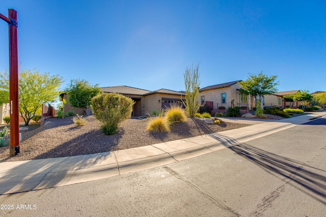 3285 Big Sky Dr, Wickenburg, AZ 85390 - view of front facade with an attached garage and a residential view