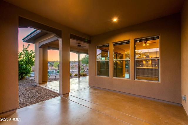 3285 Big Sky Dr, Wickenburg, AZ 85390 - patio terrace at dusk with a patio and a ceiling fan