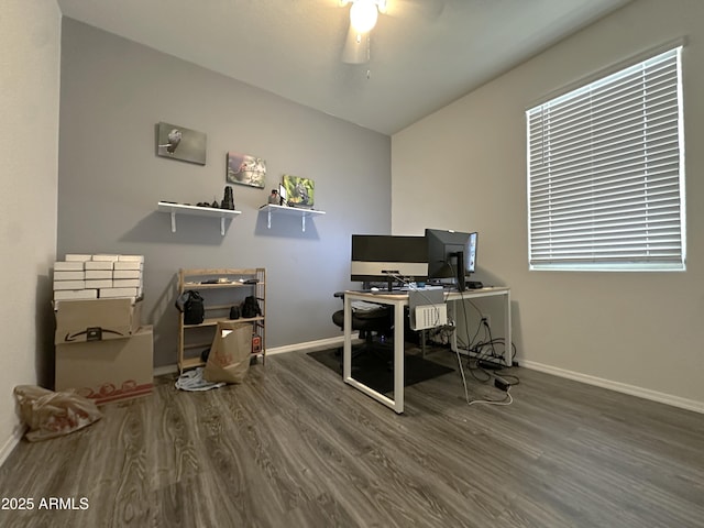 home office featuring baseboards, lofted ceiling, ceiling fan, and wood finished floors