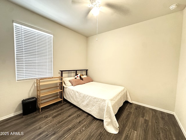 bedroom with baseboards, wood finished floors, and ceiling fan