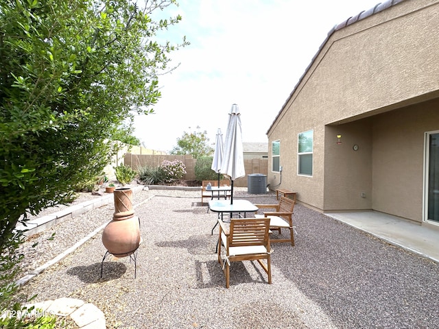 view of patio / terrace with central AC unit and a fenced backyard