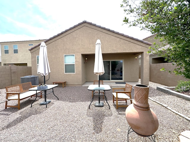 exterior space featuring fence and central AC