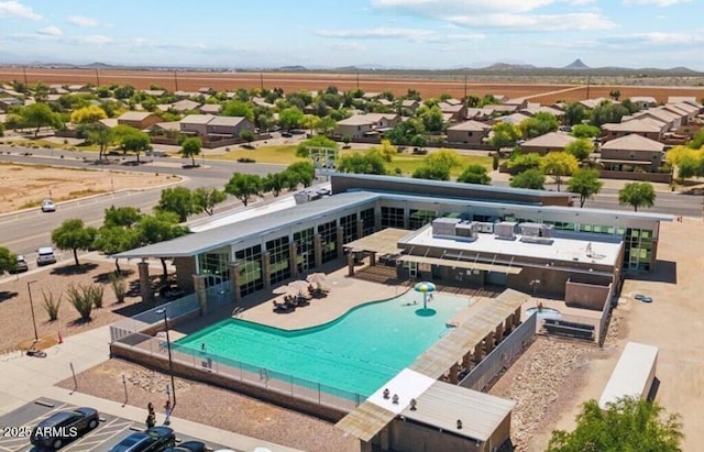 pool with fence and a patio area