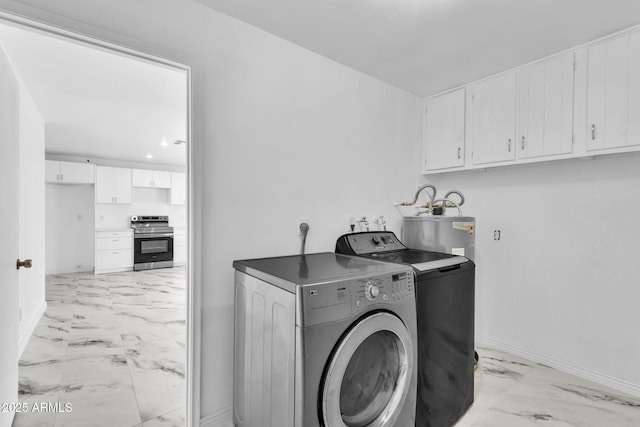 washroom featuring water heater, marble finish floor, laundry area, and baseboards