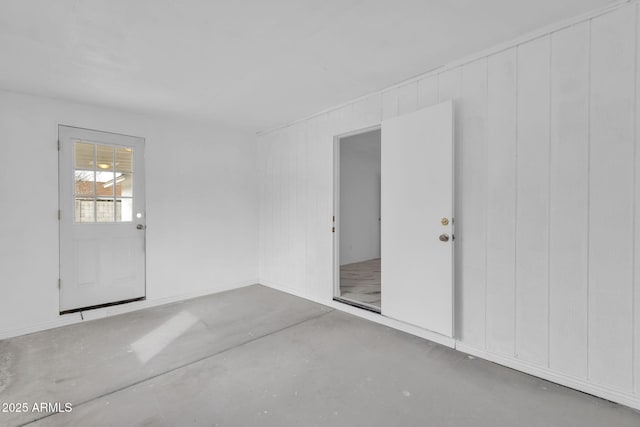 spare room featuring concrete floors