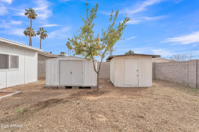 view of shed featuring a fenced backyard