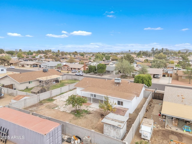 birds eye view of property with a residential view