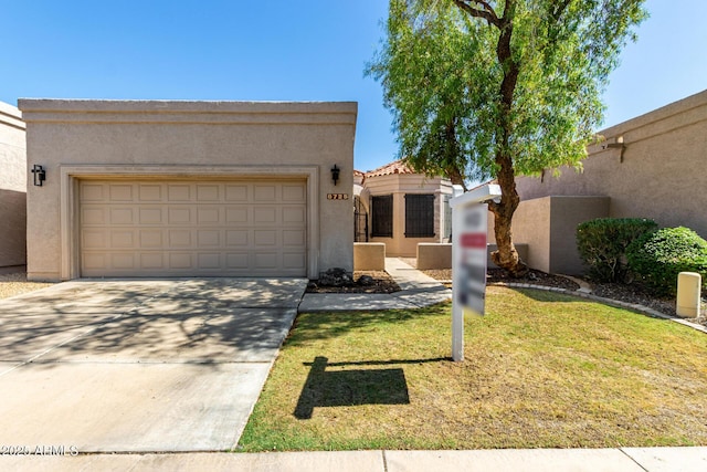 8725 E Via Del Arbor, Scottsdale, AZ 85258 - southwest-style home featuring stucco siding, concrete driveway, a front yard, and an attached garage