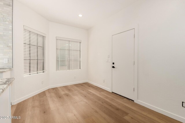 8725 E Via Del Arbor, Scottsdale, AZ 85258 - unfurnished room with light wood finished floors and recessed lighting