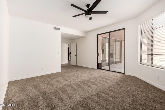 8725 E Via Del Arbor, Scottsdale, AZ 85258 - unfurnished room featuring a ceiling fan and carpet