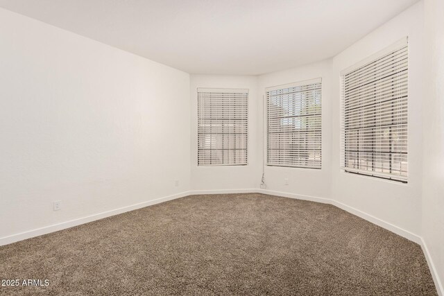 8725 E Via Del Arbor, Scottsdale, AZ 85258 - carpeted spare room with baseboards