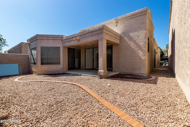 8725 E Via Del Arbor, Scottsdale, AZ 85258 - back of house with a patio and stucco siding