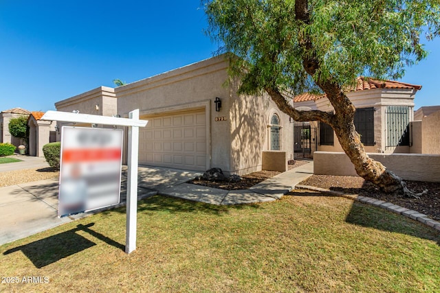 8725 E Via Del Arbor, Scottsdale, AZ 85258 - view of front facade featuring a garage, stucco siding, concrete driveway, a tiled roof, and a gate