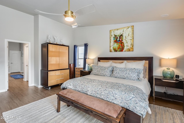 8738 W Runion Dr, Peoria, AZ 85382 - bedroom featuring wood finished floors, baseboards, and a ceiling fan