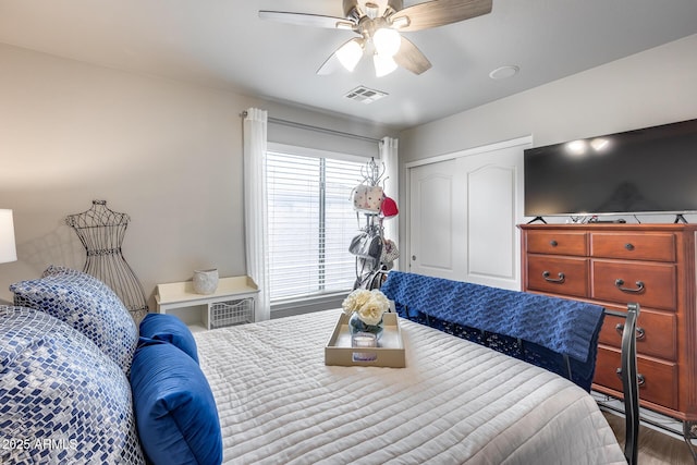 8738 W Runion Dr, Peoria, AZ 85382 - bedroom featuring ceiling fan, a closet, and wood finished floors