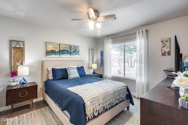8738 W Runion Dr, Peoria, AZ 85382 - bedroom with baseboards, wood finished floors, and a ceiling fan