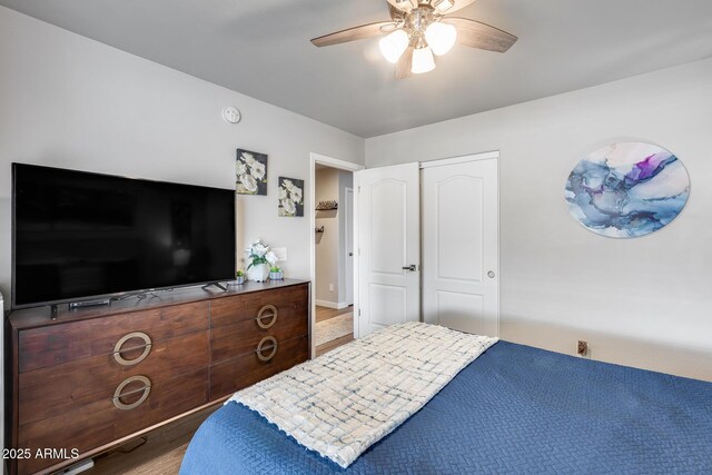 8738 W Runion Dr, Peoria, AZ 85382 - bedroom with a ceiling fan and wood finished floors
